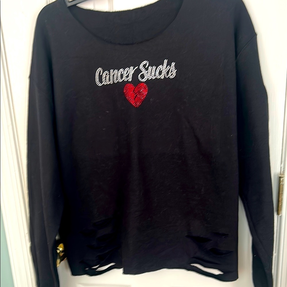 Distressed black sweatshirt with “Cancer Sucks” with Red Sequined Heart.
